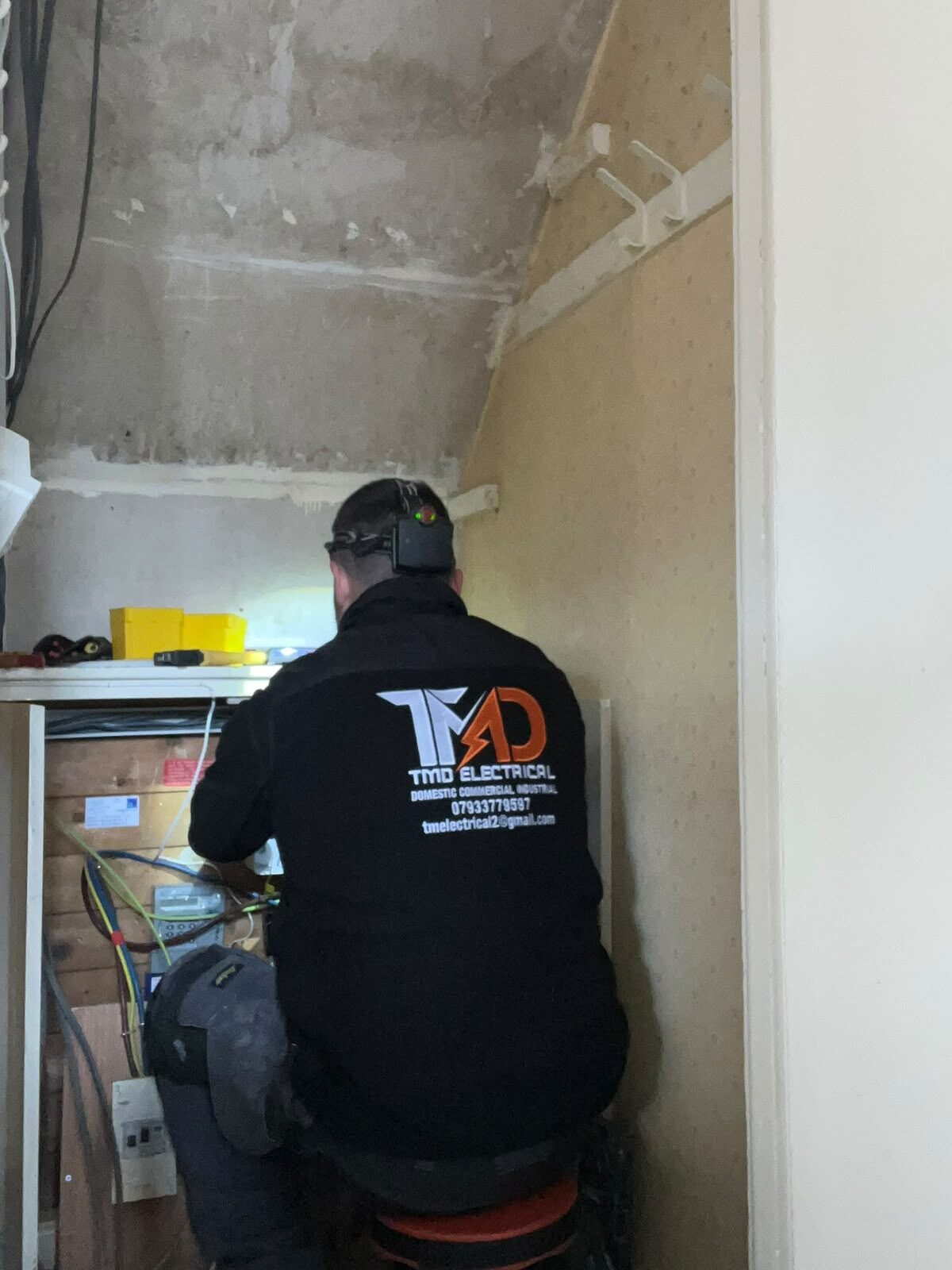 TMD electrician working on a fuse board