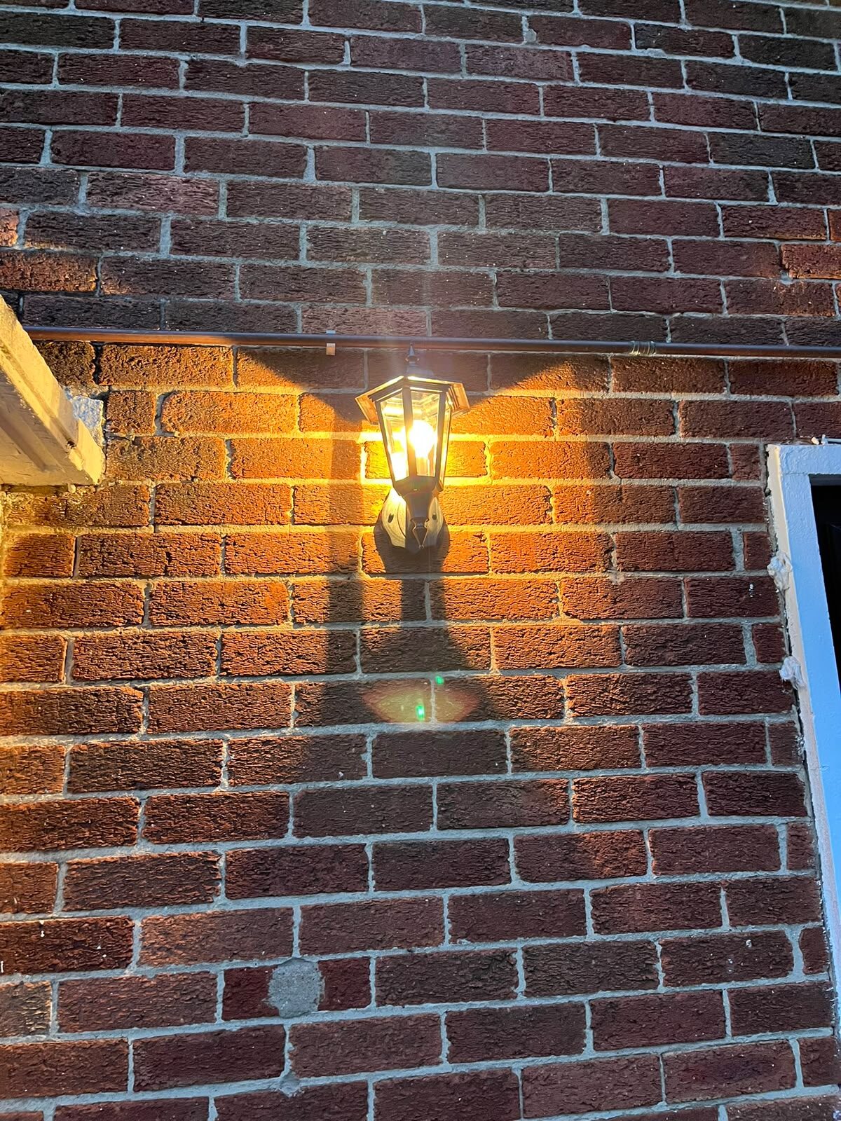 Outdoor lantern wall light fitted by TMD Electrical